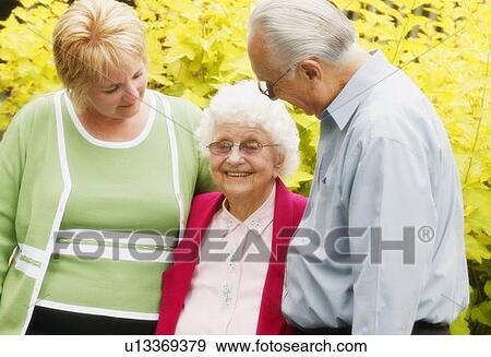Adoring a senior View Large Photo Image Stock Photo - Adoring a senior. Fotosearch