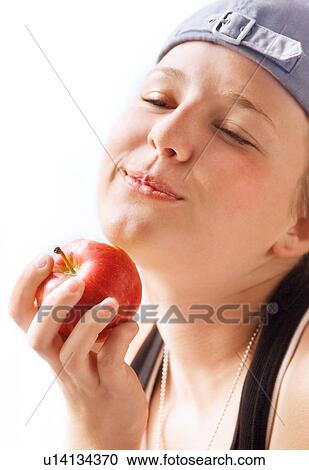 Child bites into apple View Large Photo Image Stock Image - Child bites into apple. Fotosearch