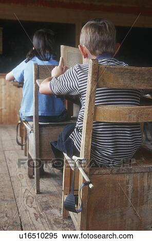 Stock Photography - Children in an old classroom. Fotosearch