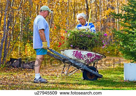 Stock Photo - Couple doing yard work. Fotosearch