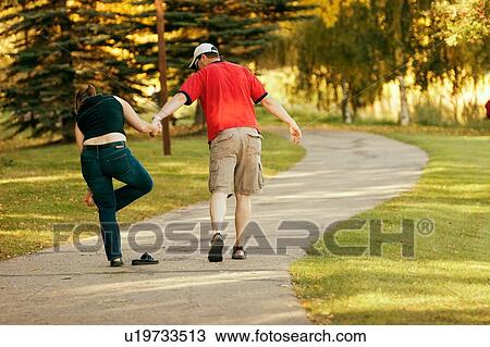 Couple going for a walk View Large Photo Image Stock Image - Couple going for a walk. Fotosearch