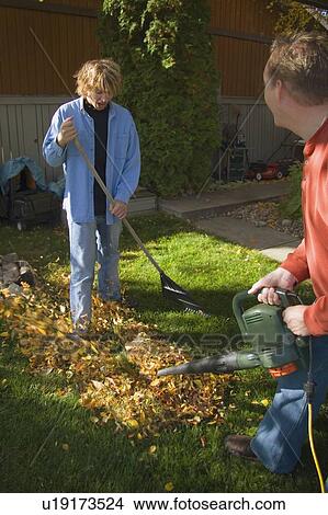 Father discourages son's work View Large Photo Image Picture - Father discourages son's work. Fotosearch