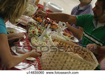 Friends at a picnic View Large Photo Image Stock Image - Friends at a picnic. Fotosearch