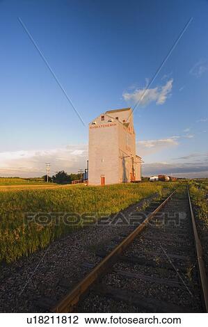 Grain elevator along side of railway tracks View Large Photo Image Stock Image - Grain elevator along side of railway tracks. Fotosearch