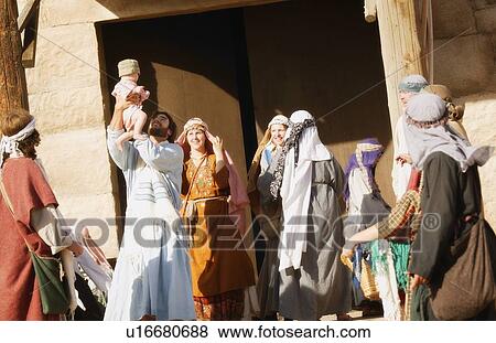 Stock Photo - Group celebrating outside synagogue. Fotosearch