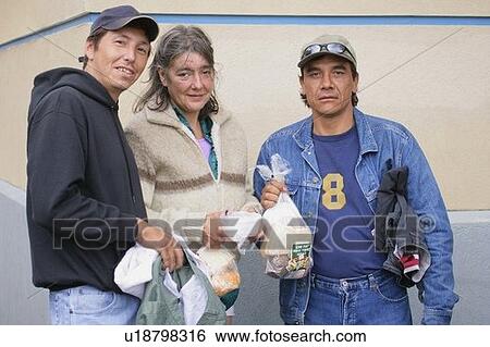 Stock Photograph - Homeless stopping for lunch. Fotosearch