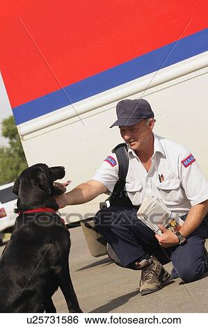 Mail carrier pets dog View Large Photo Image Stock Photograph - Mail carrier pets dog. Fotosearch