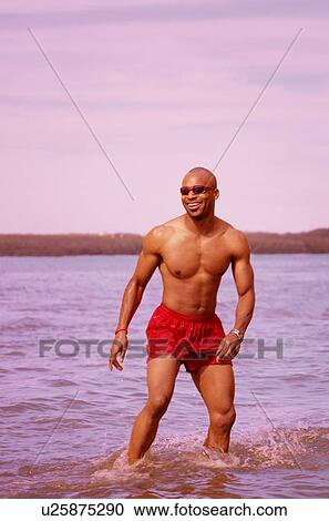 Man at the beach View Large Photo Image Stock Image - Man at the beach. Fotosearch