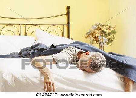 Man sleeping in bed View Large Photo Image Stock Image - Man sleeping in bed. Fotosearch