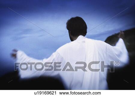 Stock Image - Man with arms outstretched. Fotosearch