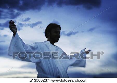 Stock Photo - Man with arms outstretched. Fotosearch