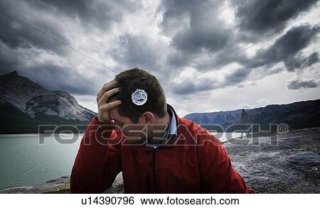 Stock Photograph - Man with compass graphic on head. Fotosearch