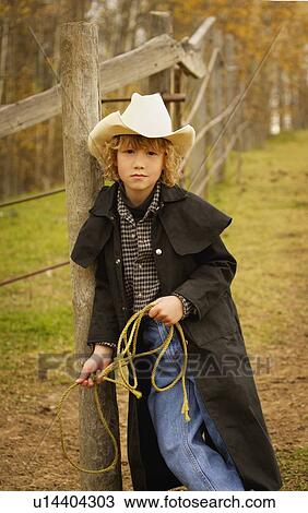 Portrait of young cowboy View Large Photo Image Stock Image - Portrait of young cowboy. Fotosearch