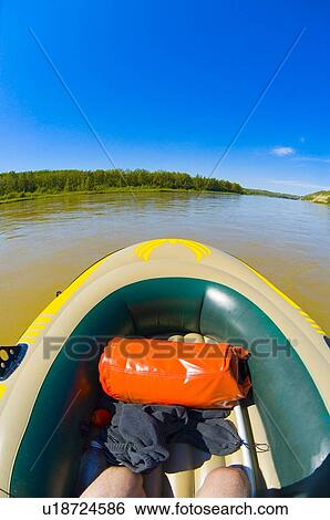 Stock Photograph - Rubber boat on water. Fotosearch