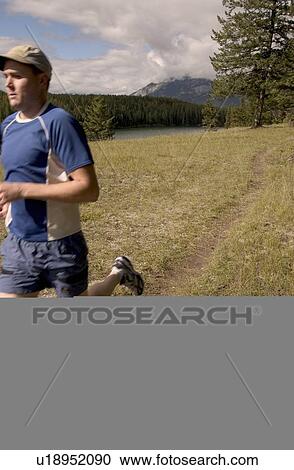Stock Image - Running through the mountains. Fotosearch