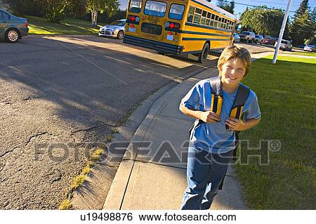Stock Photograph - School bus drops child off. Fotosearch
