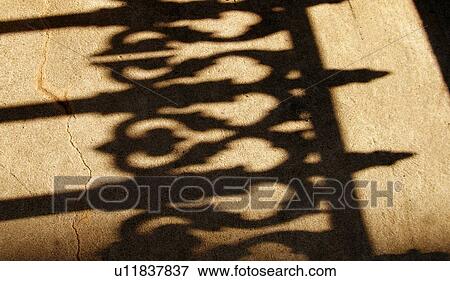 Shadow of an iron fence View Large Photo Image Stock Photo - Shadow of an iron fence. Fotosearch