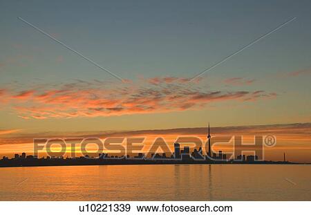 Skyline of Toronto against a beautiful sunset View Large Photo Image Stock Photo - Skyline of Toronto against a beautiful sunset. Fotosearch