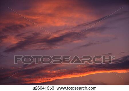 Stock Image - Sunset on clouds. Fotosearch