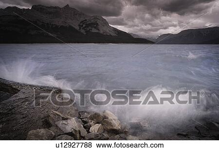 Threatening skies and rock shoreline View Large Photo Image Stock Photo - Threatening skies and rock shoreline. Fotosearch