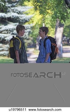 Two boys with backpacks View Large Photo Image Stock Image - Two boys with backpacks. Fotosearch