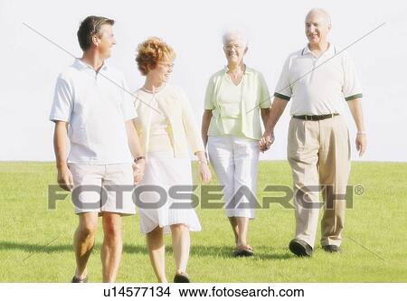 Picture - Two Couples Walking. Fotosearch