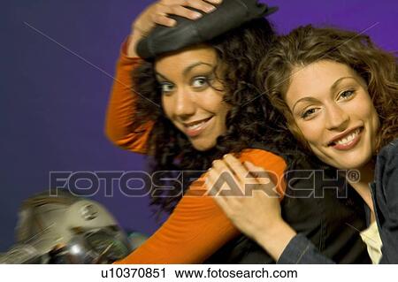 Two women on a motorcycle View Large Photo Image Stock Image - Two women on a motorcycle. Fotosearch
