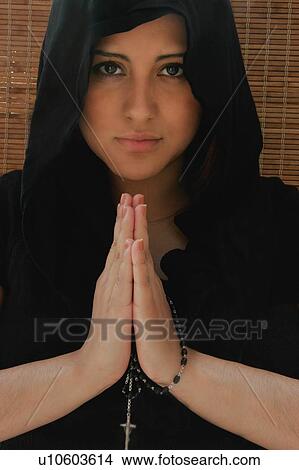 Picture - Woman with prayer beads. Fotosearch
