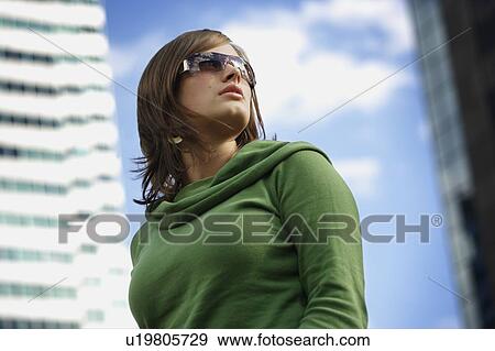 Woman with trendy sunglasses View Large Photo Image Stock Photo - Woman with trendy sunglasses. Fotosearch