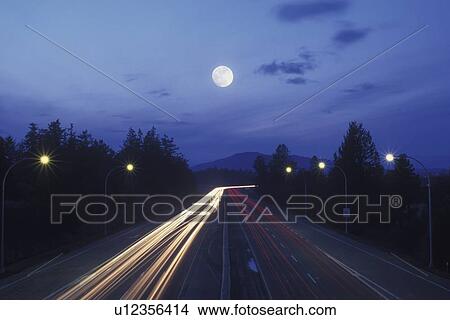 Picture - Blurred motion of traffic on a busy road. Fotosearch