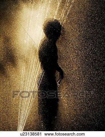 Child playing in a sprinkler View Large Photo Image Stock Image - Child playing in a sprinkler. Fotosearch