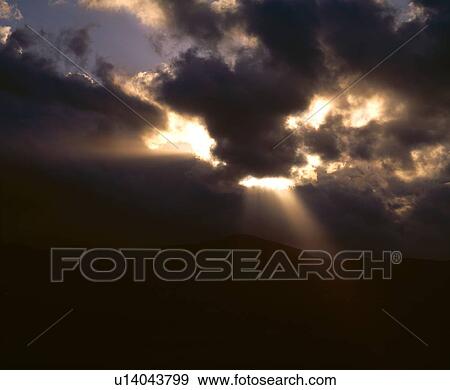 Stock Photo - Cloudscape with sunburst. Fotosearch