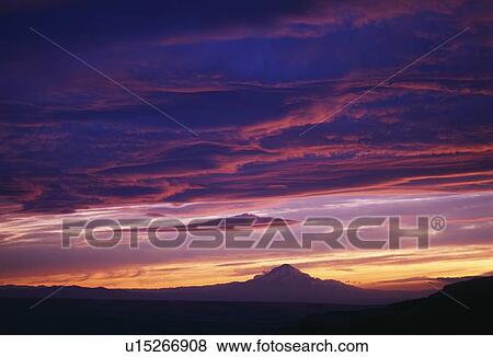 Stock Photo - Distant Mount Hood in sunset. Fotosearch