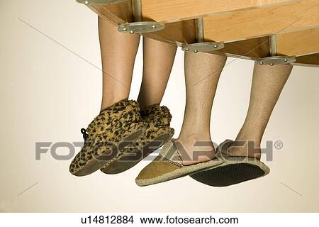 Picture - Feet Hanging Over Balcony. Fotosearch