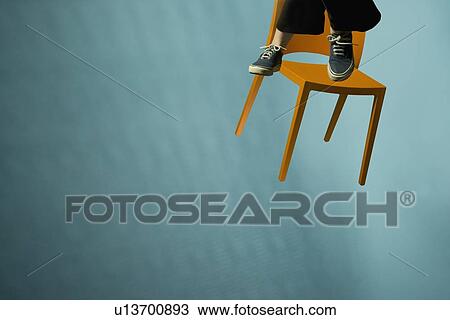 Stock Image - Floating Chair. Fotosearch