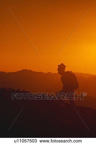 Hiker silhouette, sunset on Aneroid Mountain, Eaglecap Wilderness View Large Photo Image Stock Image - Hiker silhouette, sunset on Aneroid Mountain, Eaglecap Wilderness. Fotosearch