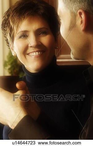 Man and woman conversing over coffee View Large Photo Image Stock Image - Man and woman conversing over coffee. Fotosearch