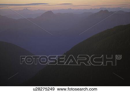 Mountains covered with fog View Large Photo Image Stock Photo - Mountains covered with fog. Fotosearch