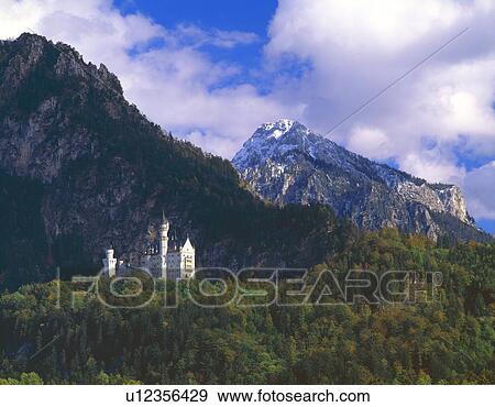 Neuschwannstein, fairytale castle built by Mad King Ludwig of Bavaria View Large Photo Image Stock Photo - Neuschwannstein, fairytale castle built by Mad King Ludwig of Bavaria. Fotosearch