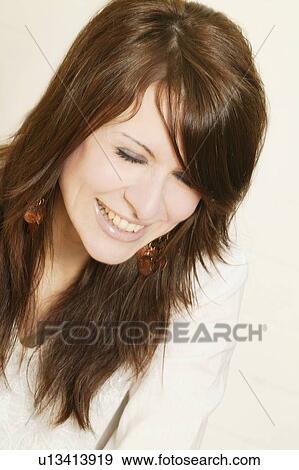 Stock Photo - Portrait of a beautiful brunette woman. Fotosearch