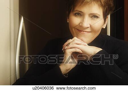 Portrait of a woman smiling View Large Photo Image Stock Photograph - Portrait of a woman smiling. Fotosearch