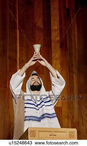 Rabbi blessing communion wine View Large Photo Image Stock Image - Rabbi blessing communion wine. Fotosearch