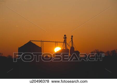 Silhouette of grain storage bins View Large Photo Image Stock Photo - Silhouette of grain storage bins. Fotosearch
