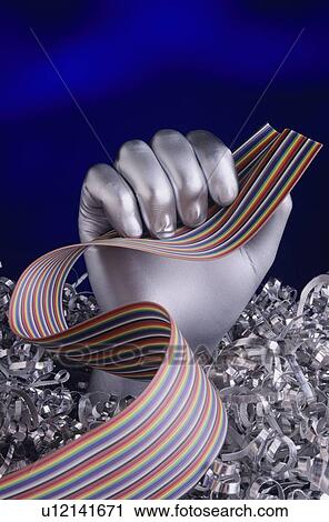Silver Hand holding Computer cable View Large Photo Image Stock Image - Silver Hand holding Computer cable. Fotosearch