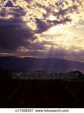 Sun rays shine down from a cloud, Owens Valley View Large Photo Image Stock Photo - Sun rays shine down from a cloud, Owens Valley. Fotosearch