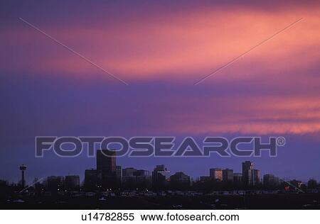 Sunset over city skyline. View Large Photo Image Stock Photography - Sunset over city skyline.. Fotosearch