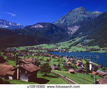 Swiss village on shore of Lake Lungernsee View Large Photo Image Stock Image - Swiss village on shore of Lake Lungernsee. Fotosearch