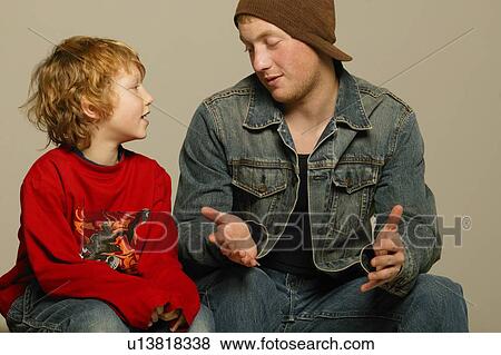 Stock Photo - Two boys interacting. Fotosearch