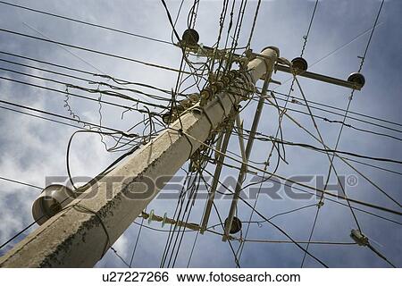 Wires clustered around pole View Large Photo Image Stock Photograph - Wires clustered around pole. Fotosearch