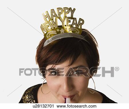 Stock Image - Woman celebrating New Year's. Fotosearch
